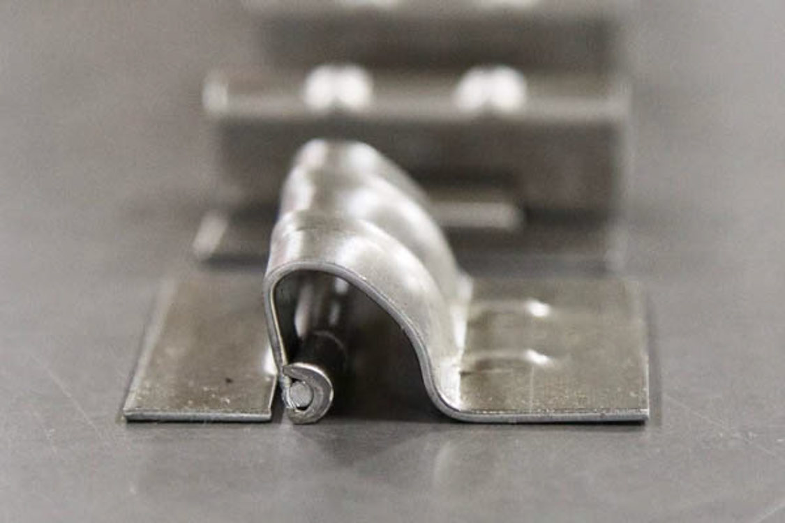 metal assembly with hinge