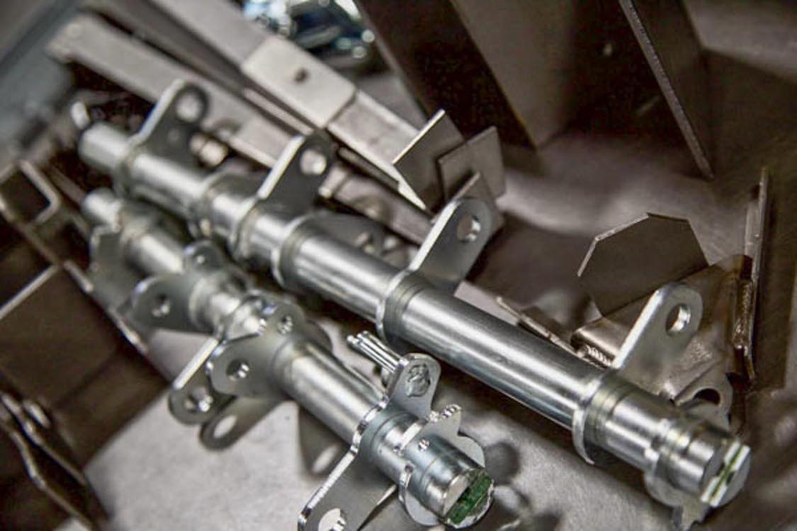 a group of 3 different metal assemblies.